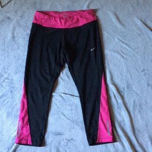Black and pink cropped Nike leggings